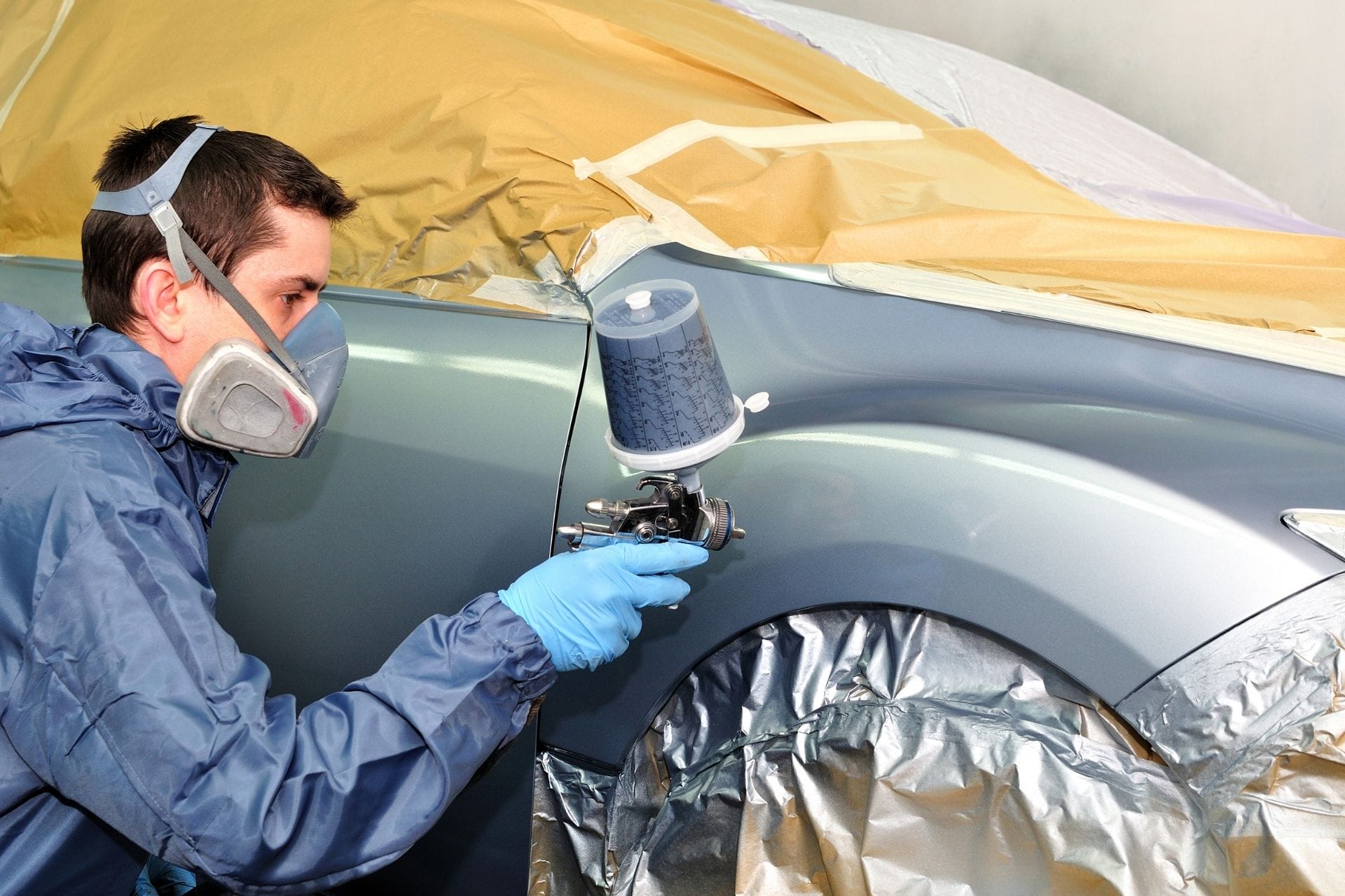 guy spraying car paint