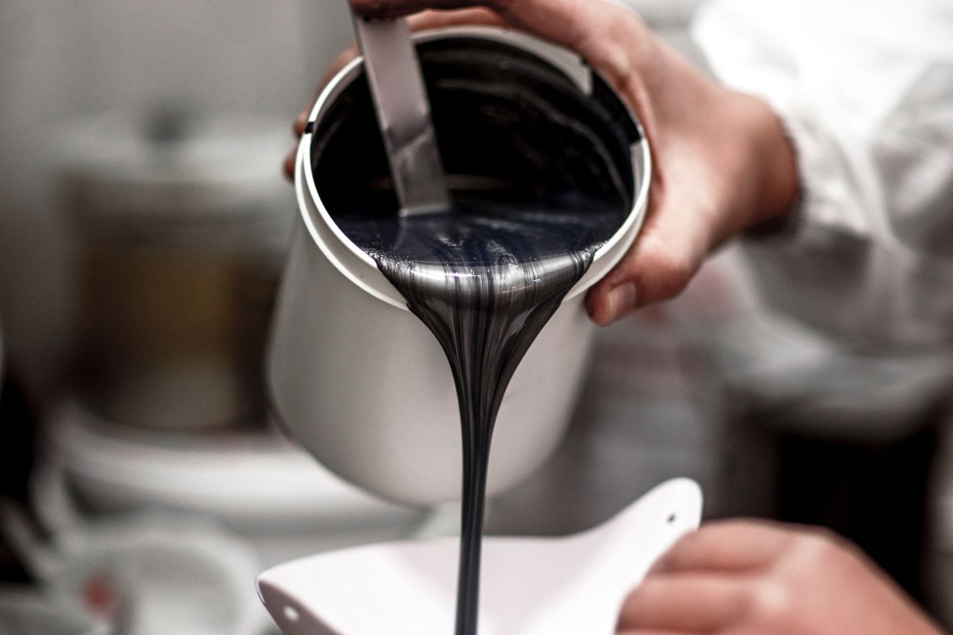 car paint black in white container