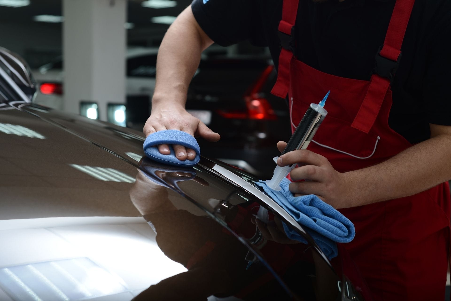 technician polishing car