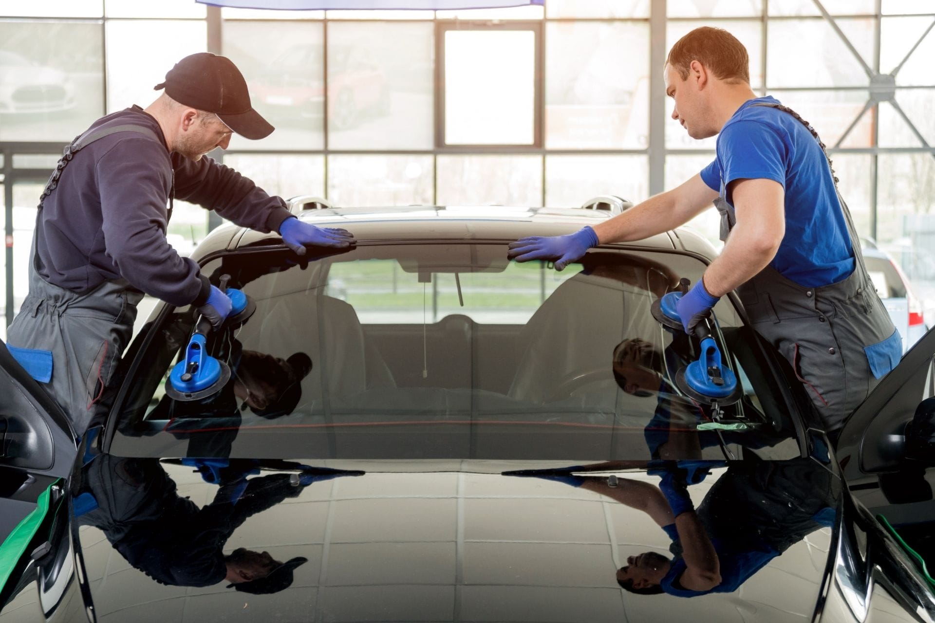 guys putting in car windshield